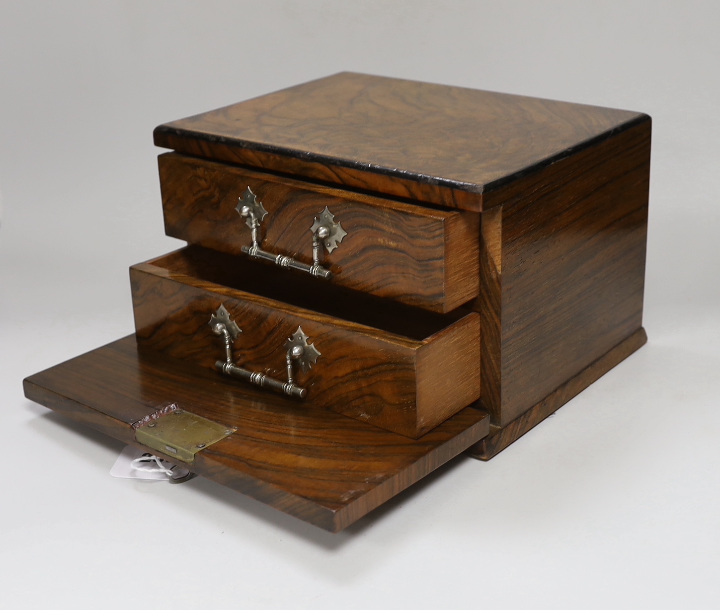 A small walnut case enclosing two drawers